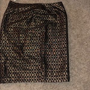 Gold and black skirt.